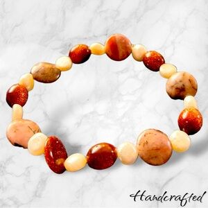 Handmade bracelet- earthtone and pearl colored beads.